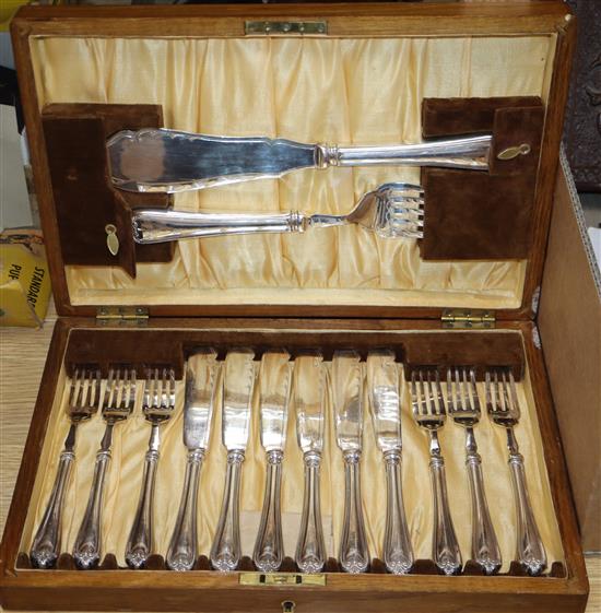 A set of oak cased silver plated fish knives and forks with servers